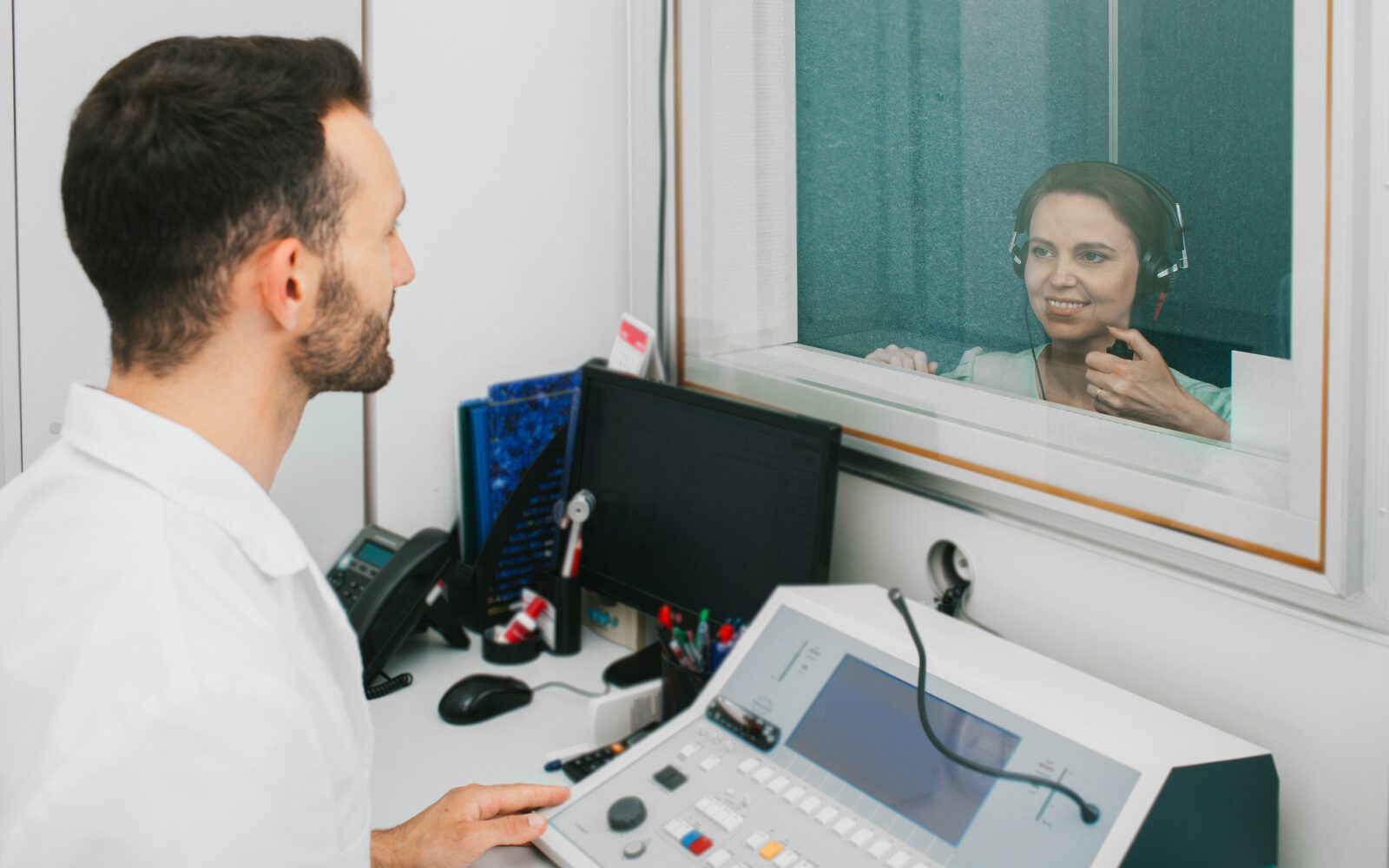 Audiologist Man Doing The Hear test
