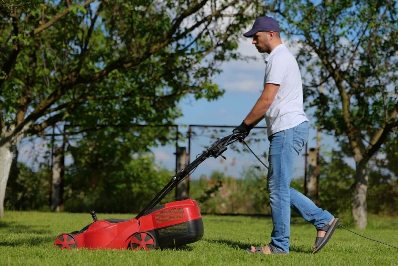 man mowing yard