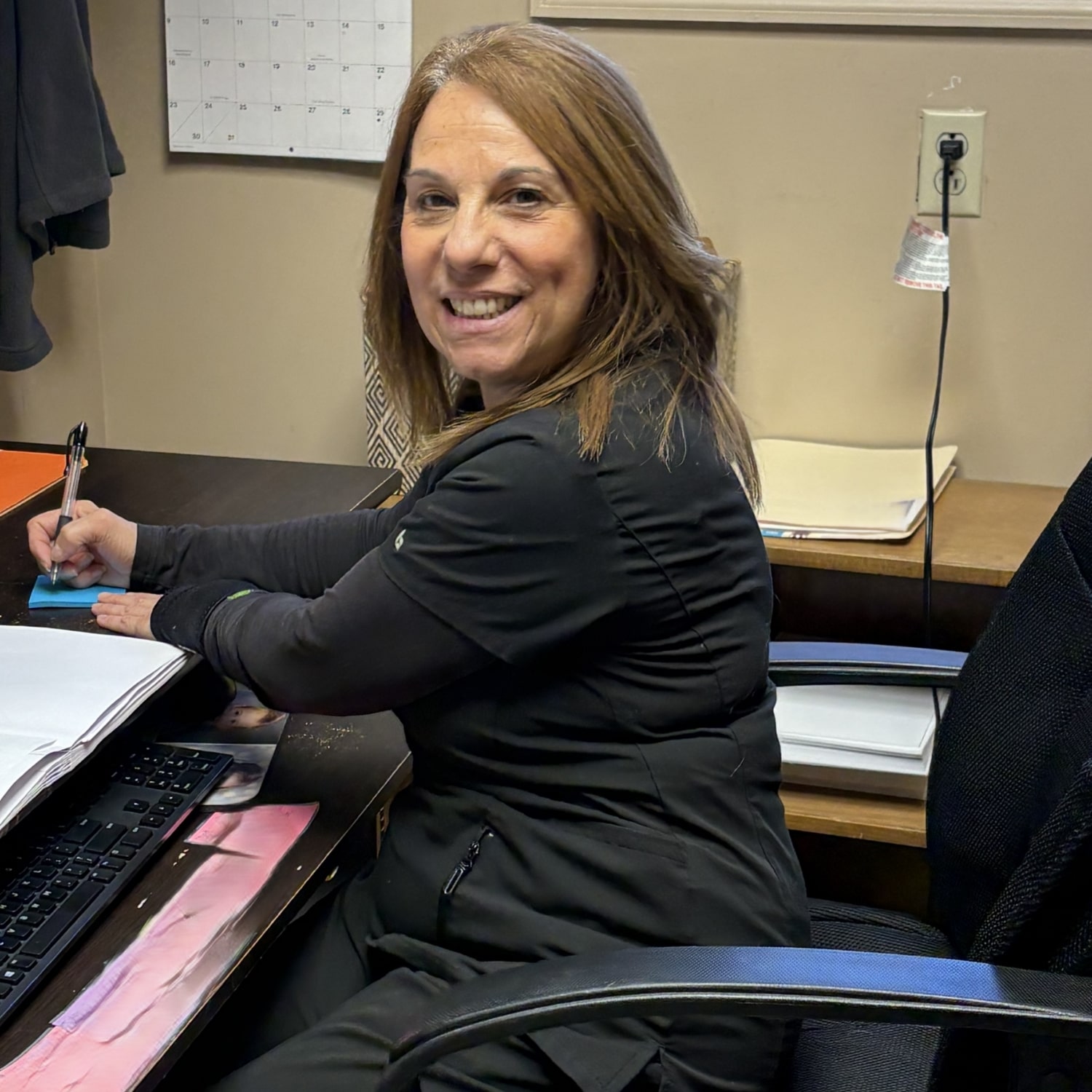 Jeanine working in the office
