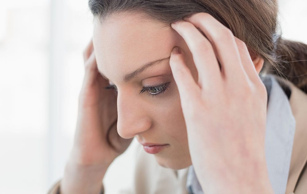 a woman with a headache