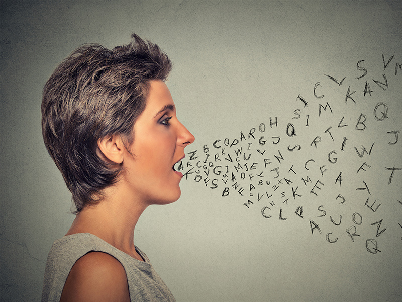 Picture of a woman with letters coming out her mouth