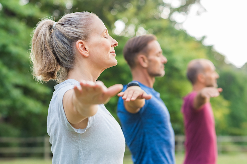 Woman is protecting herself from hearing loss by being healthy outdoors.