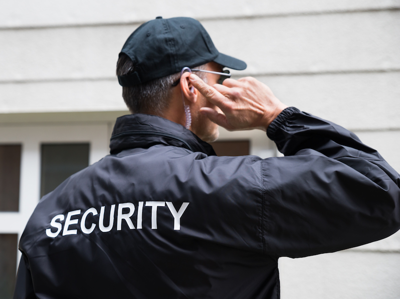 Man wearing security jacket is meant to represent practices that can keep you safe when you have hearing loss.
