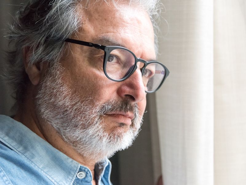 Man with hearing loss looks concerned but won't get hearing aids.