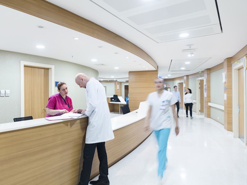 Man checking into hospital incurring healthcare costs because he did not take care of his hearing loss.