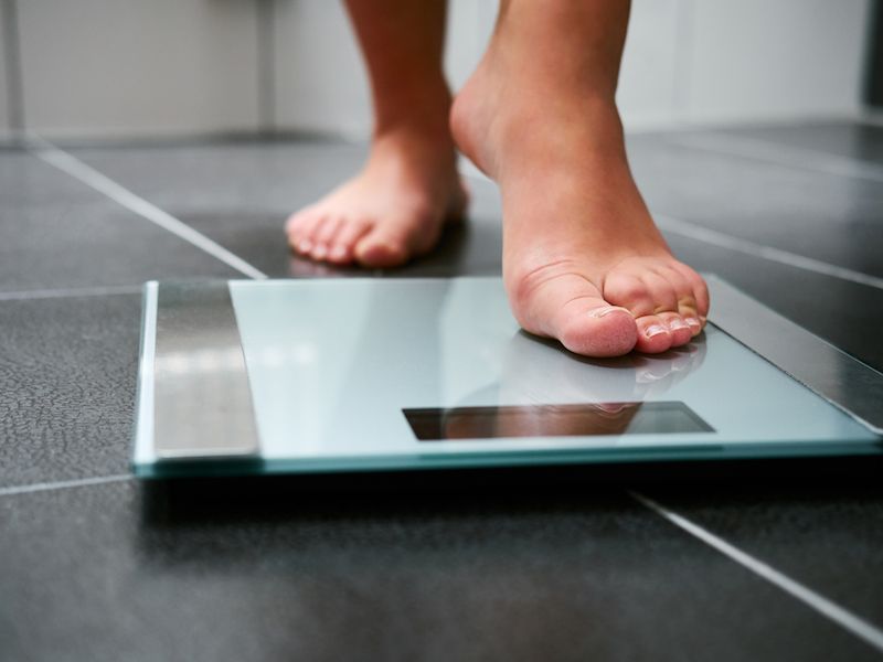 Obese woman watching her weight after learning it was causing hearing loss.