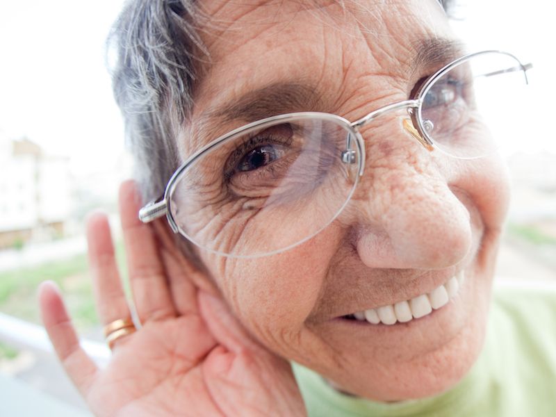 Woman struggling to hear without her hearing aids.