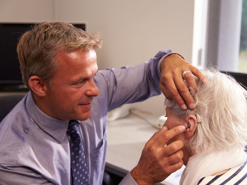 Woman considering buying hearing aids.
