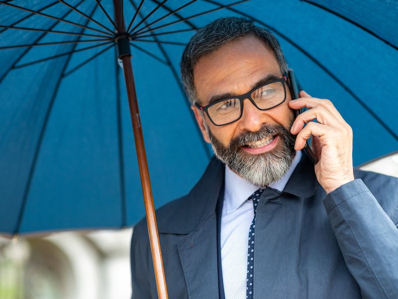 Man in denial about his hearing loss struggling to hear on the phone.