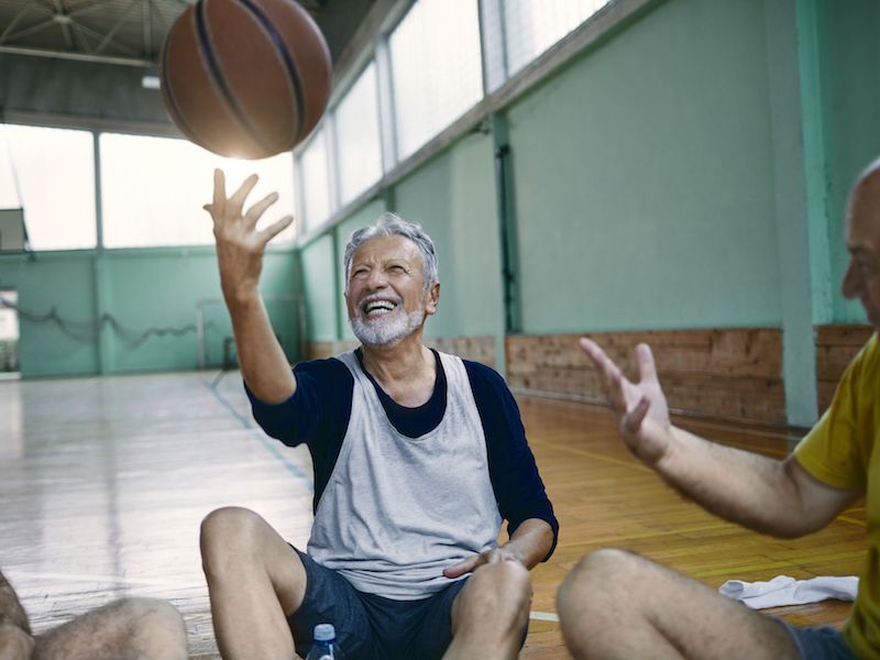 Man playing basketball wonders whether he needs new hearing aids to keep up with his active lifestyle.