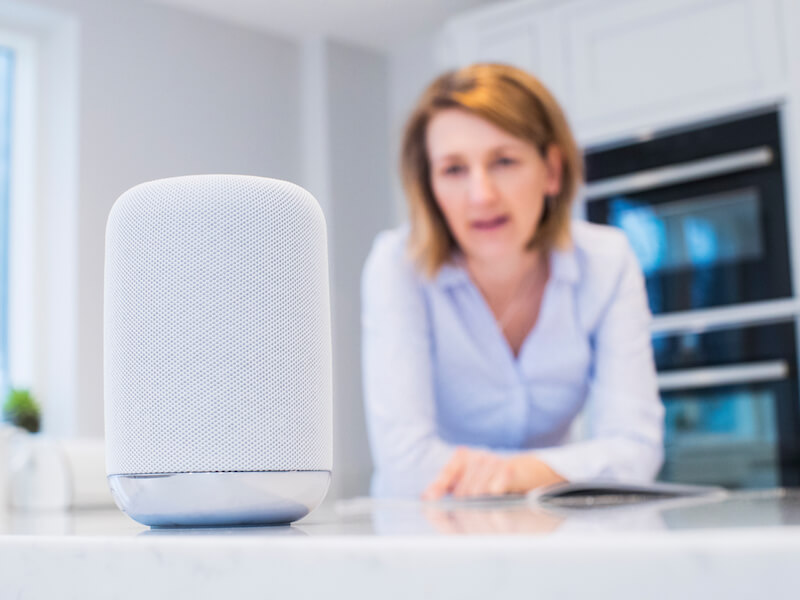 Woman connecting her hearing aids to her smart home.