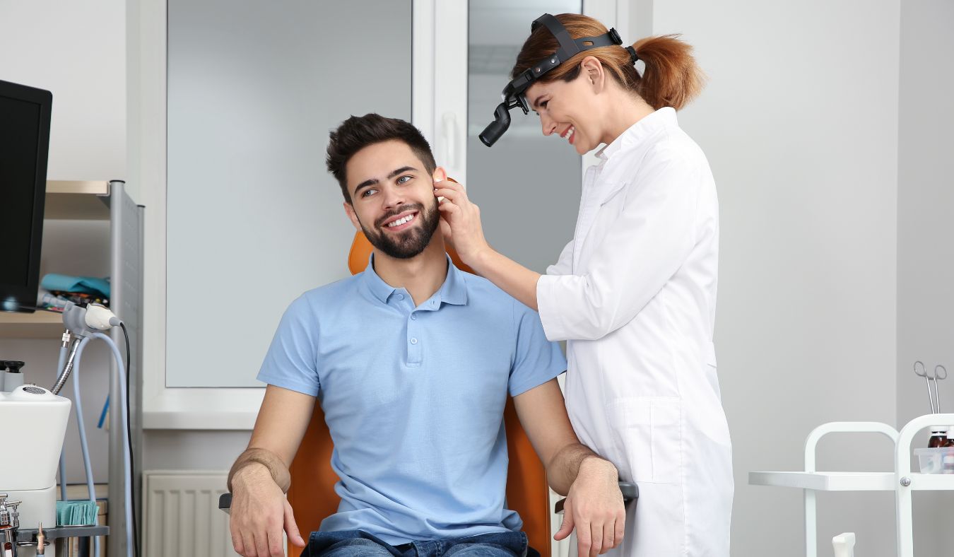 ent doctor administering an ear exam