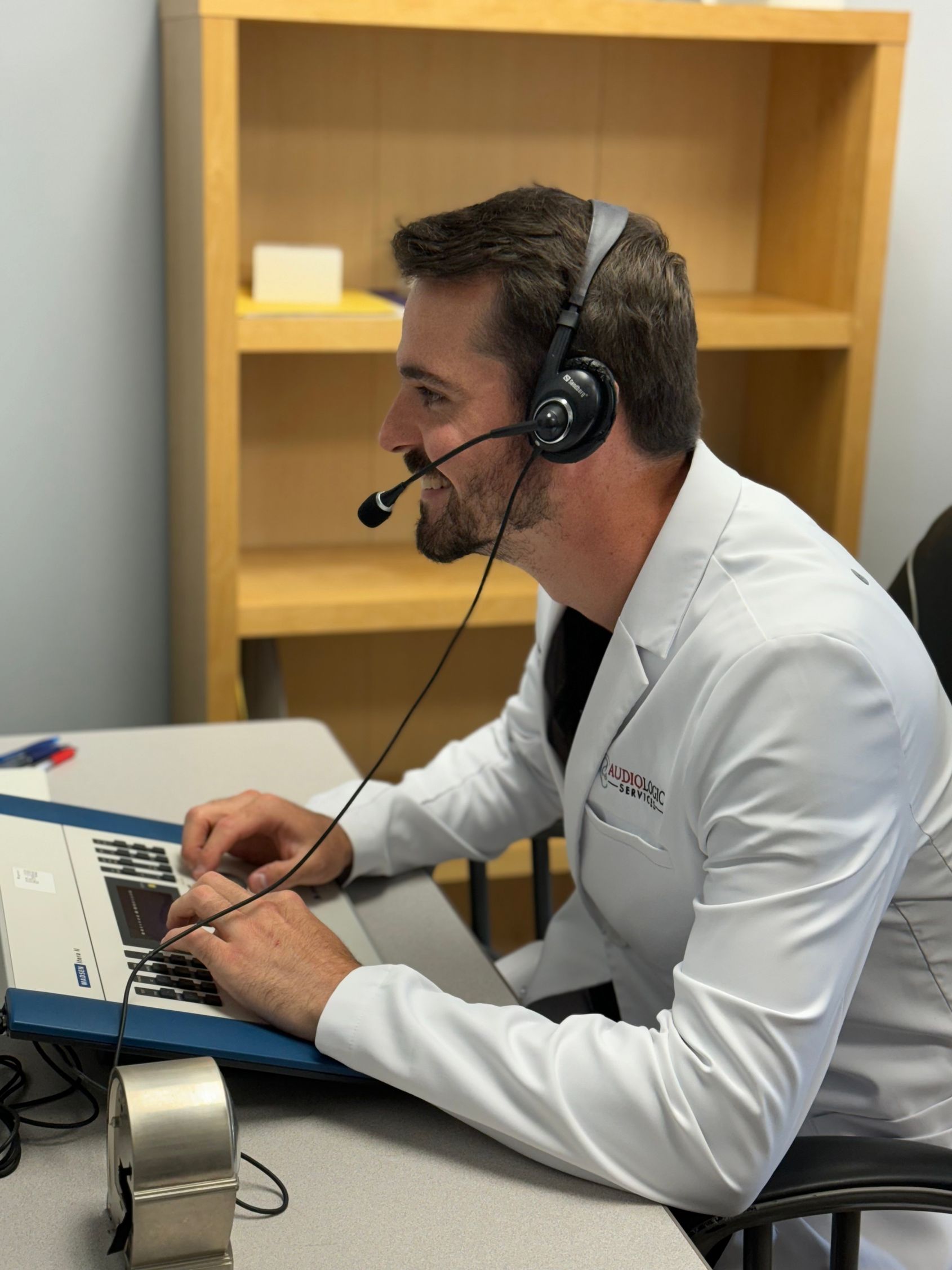 hearing provider performing hearing evaluation