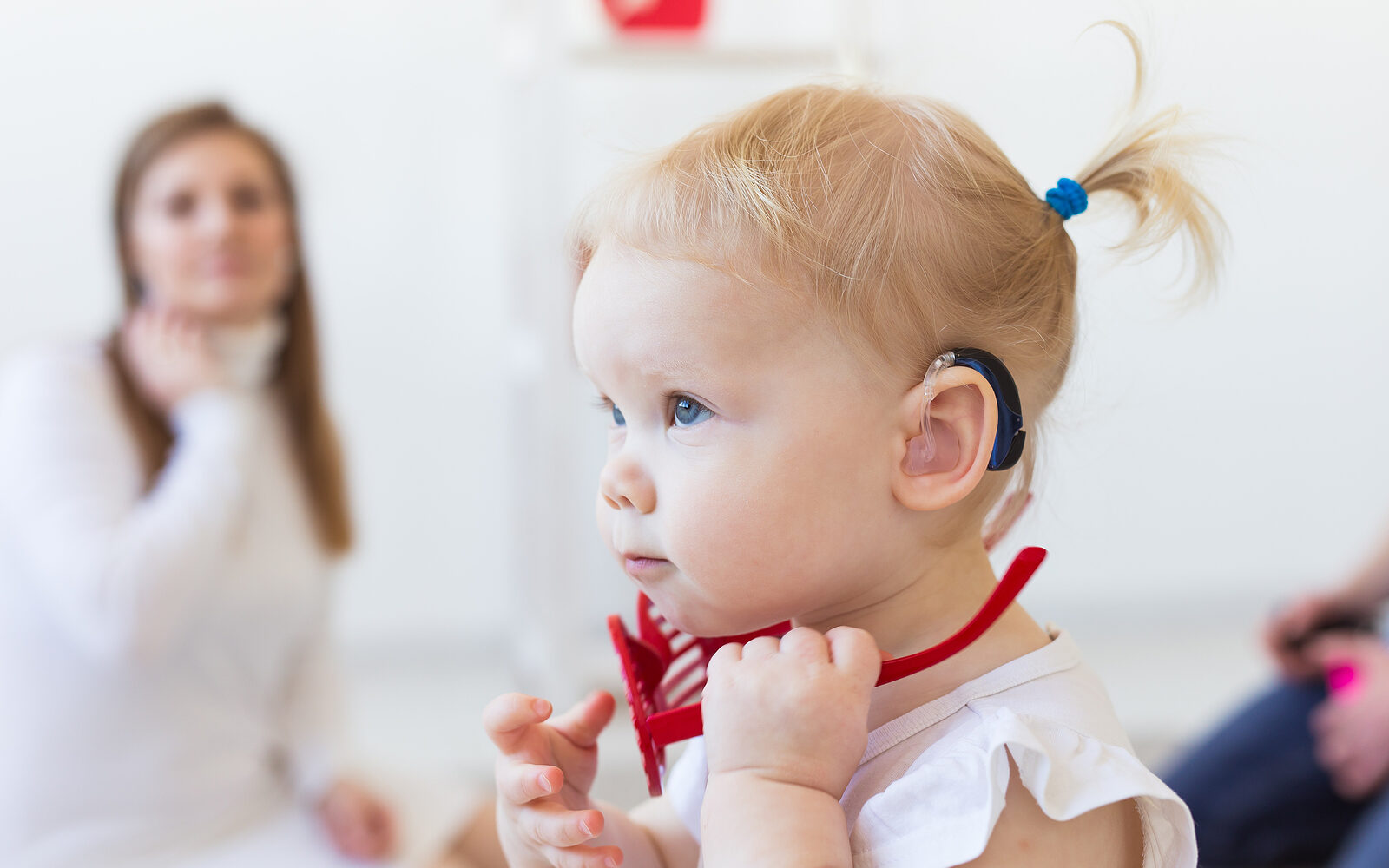 Hearing Aid In Baby Girls Ear Toddler Child Wearing A Hearing A