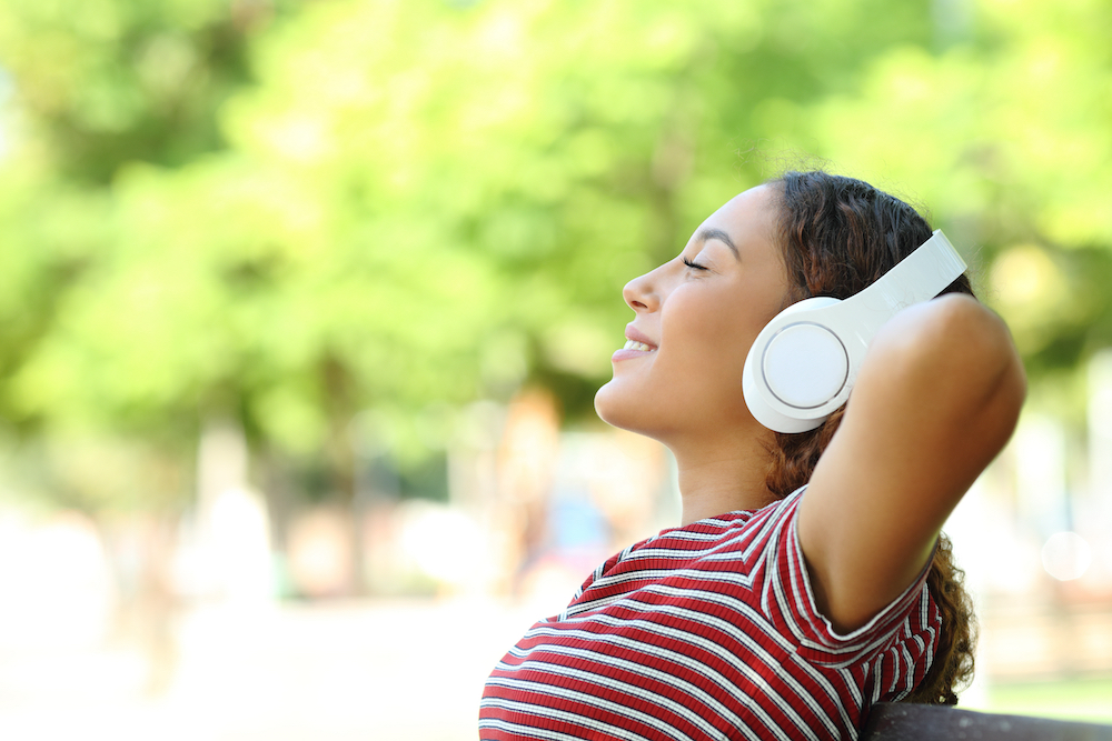 woman listening to music outdoors