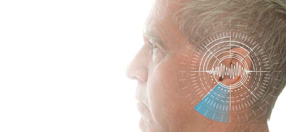 diagram of ear superimposed on mans head and ear