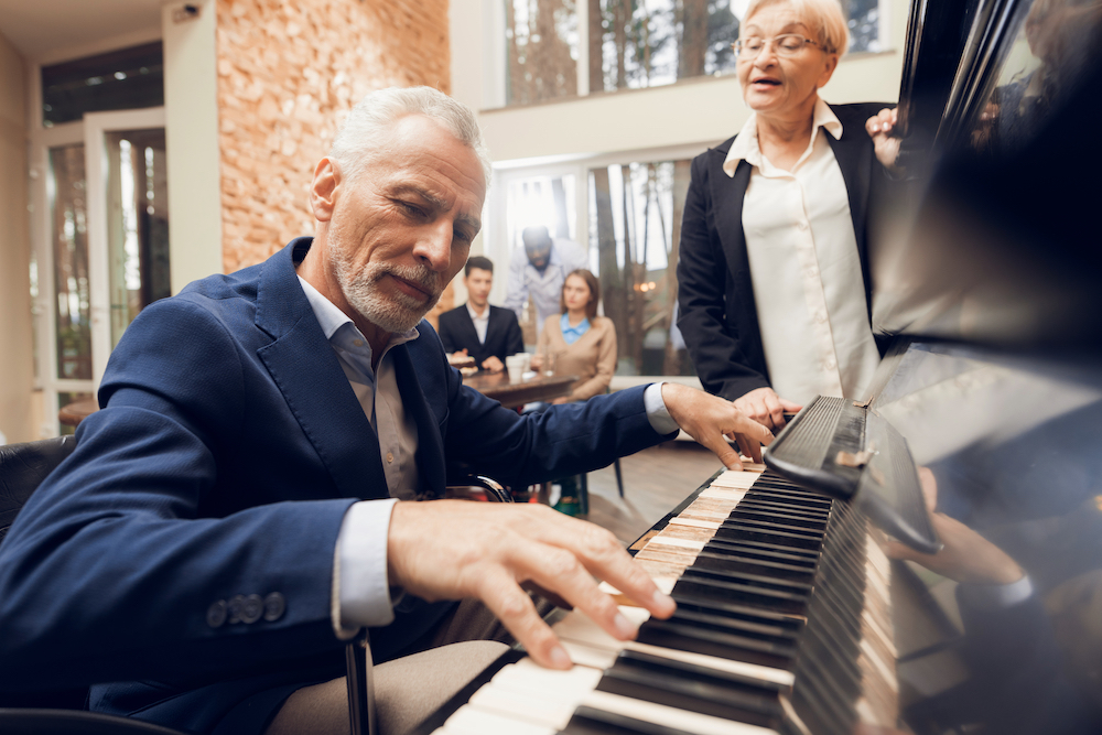 man playing piano in restaurant
