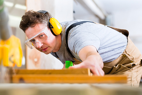 Man Working with Earmuffs