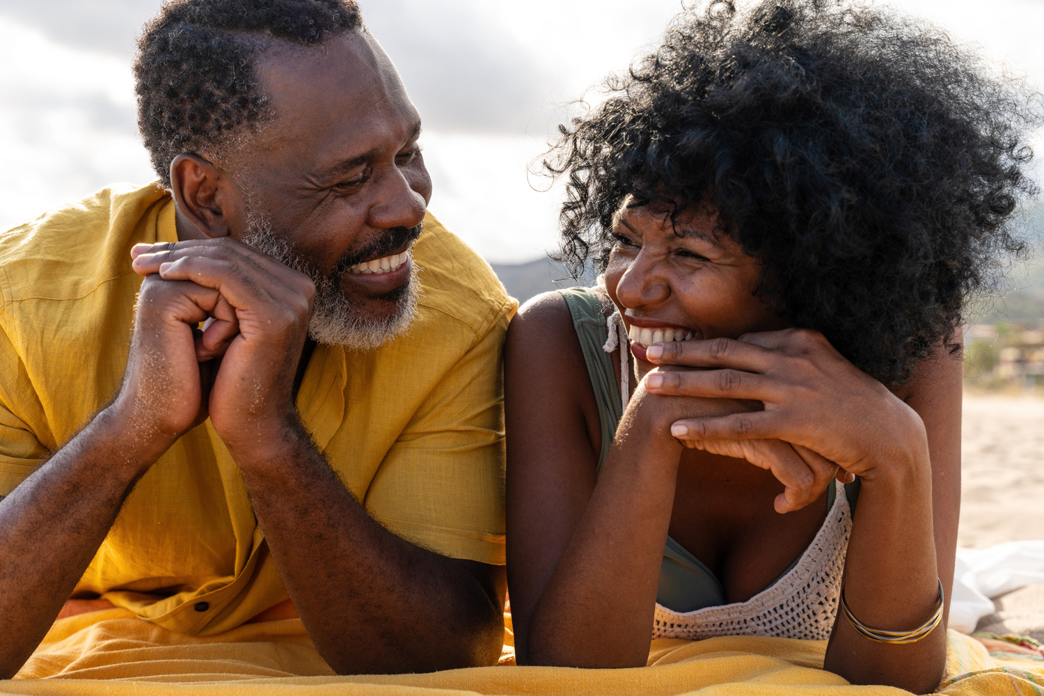 mature couple relaxing at beach