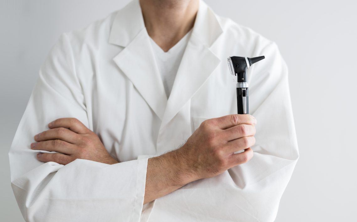 staff introduction image professional holding otoscope@2x