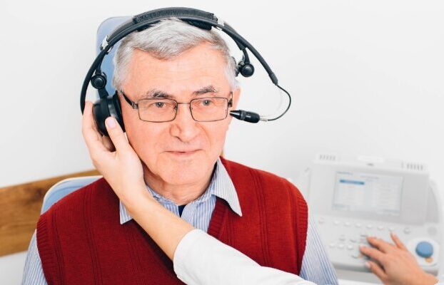 cta stacked older man taking hearing test