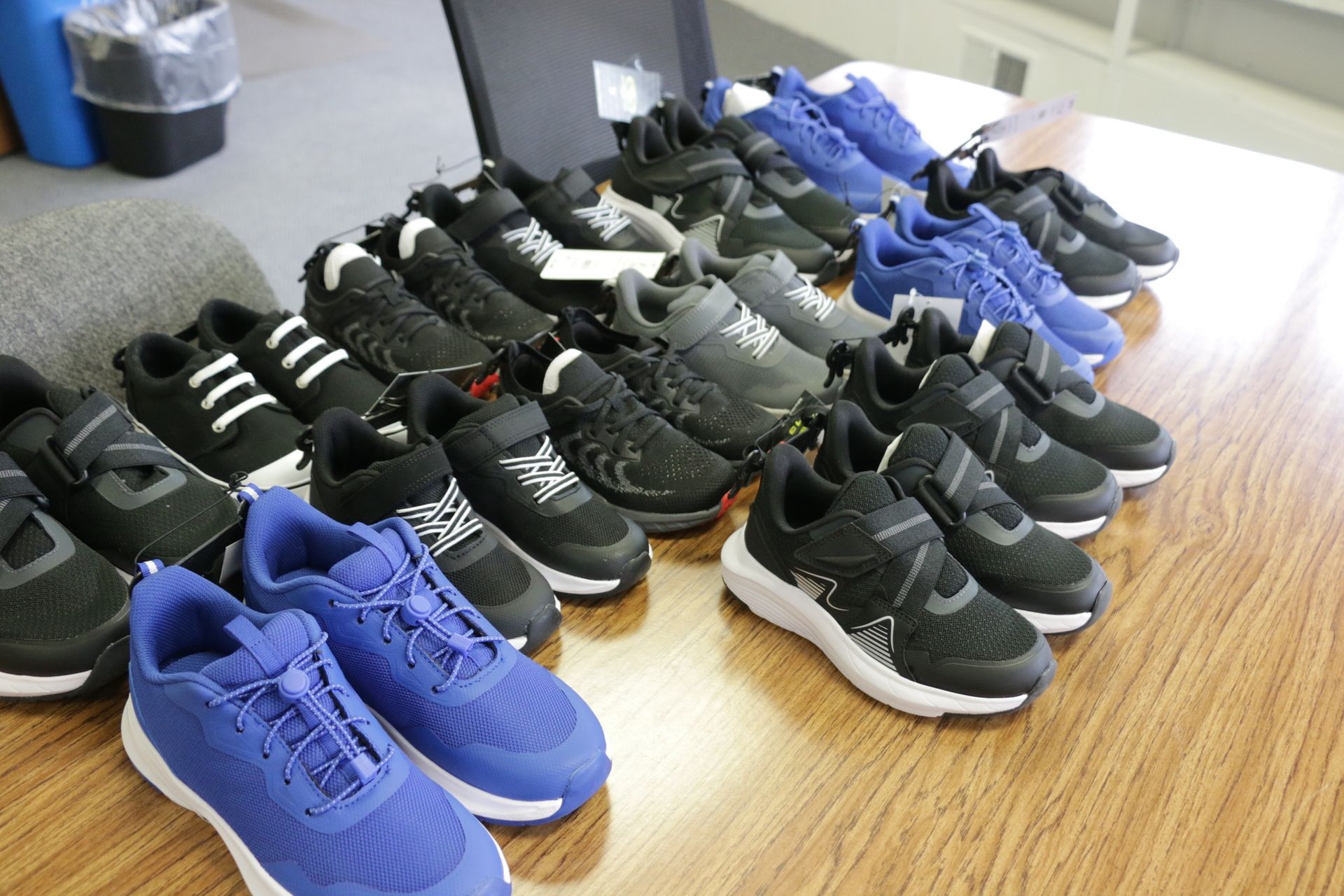 shoes ready to be donated lined up on table