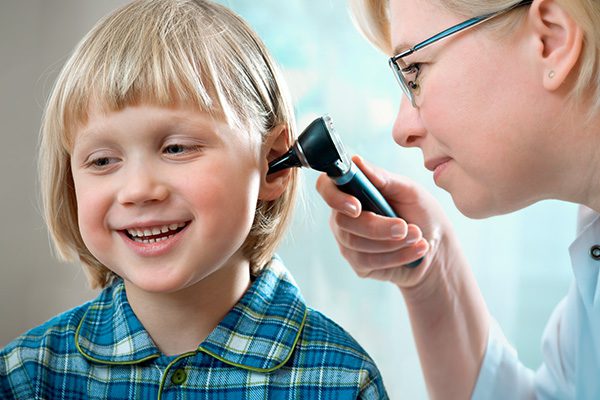 audiologist testing childs hearing ability