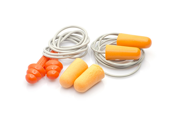 two yellow and orange foam earplugs