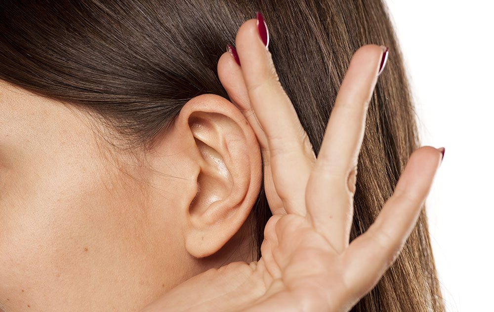 hearing loss patient holding hand to ear expressively 1