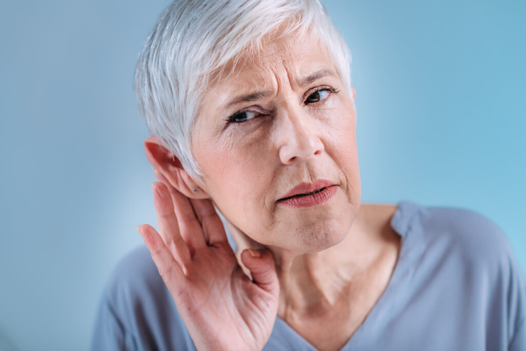Hearing Loss Senior Woman with Symptoms of Hearing Loss
