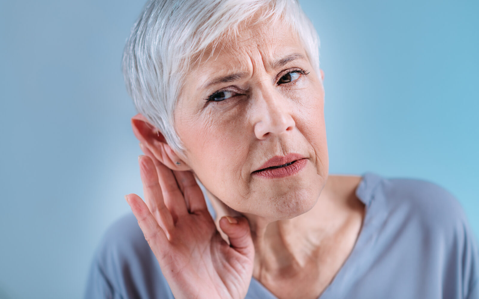 Hearing Loss Senior Woman with Symptoms of Hearing Loss