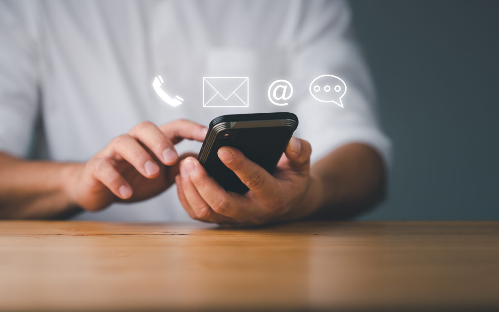 Customer support hotline Contact us people connection Businessman using Smart Phone with the email, call phone, address, Chat message icons