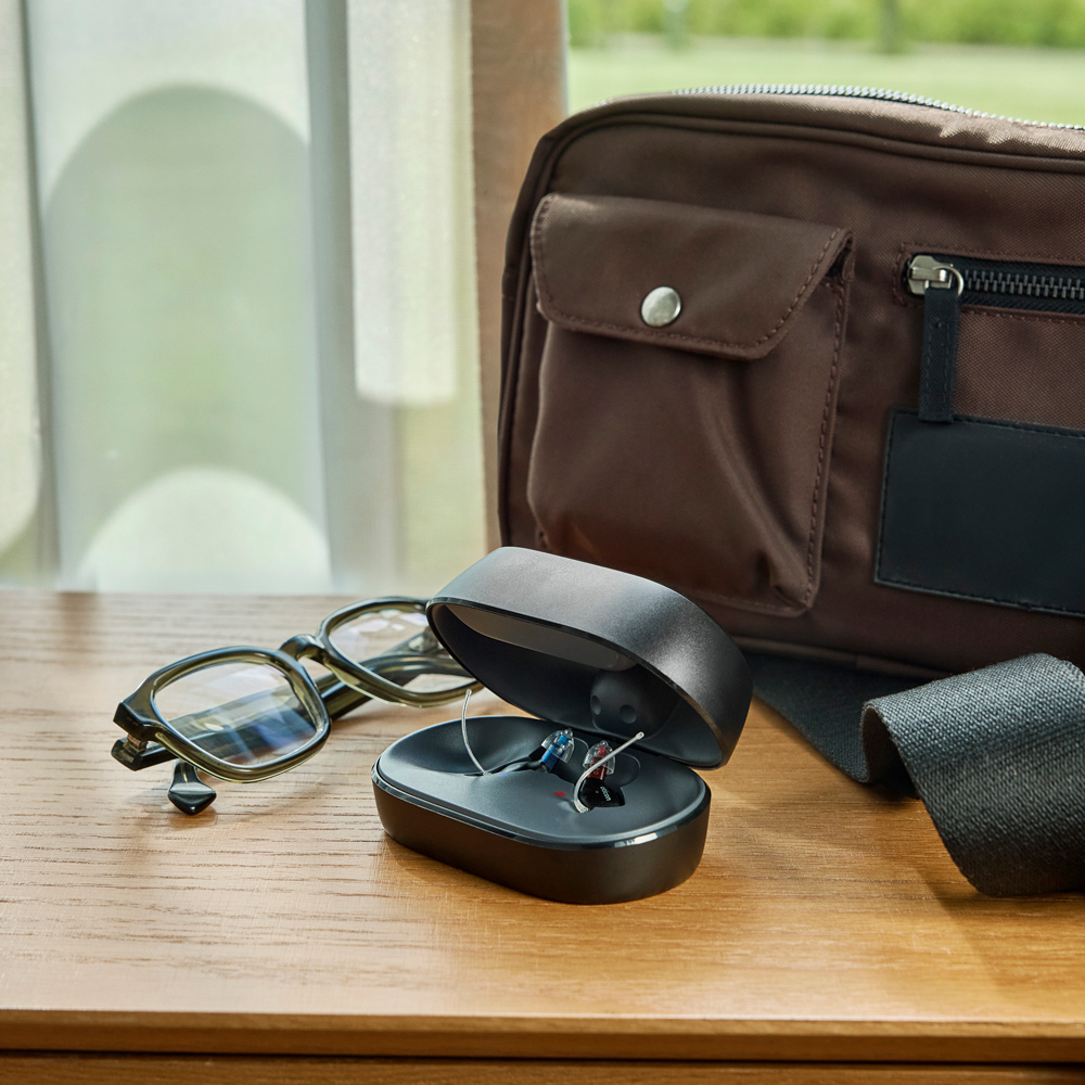 oticon zeal lifestyle square open charging case by glasses handbag