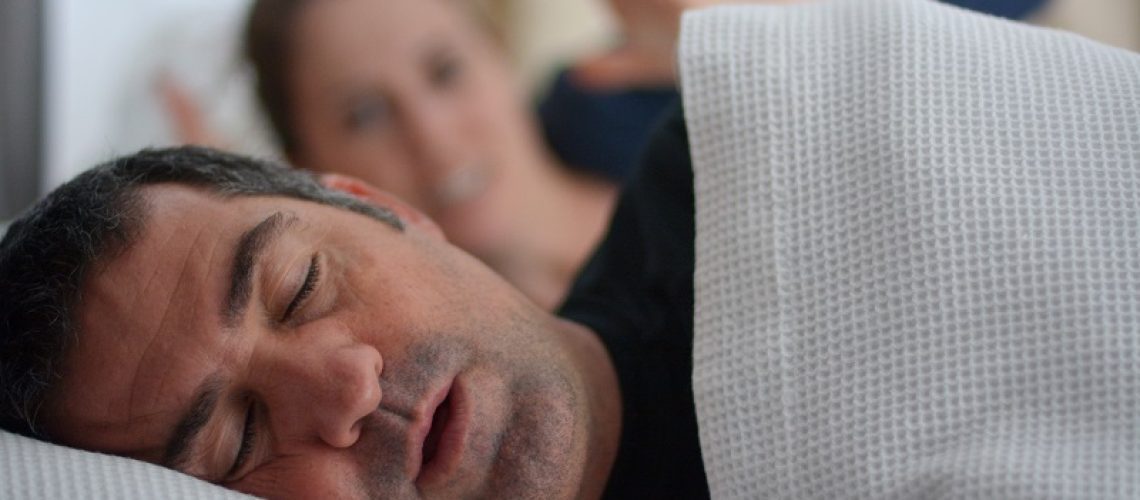 man struggling with sleep apnea