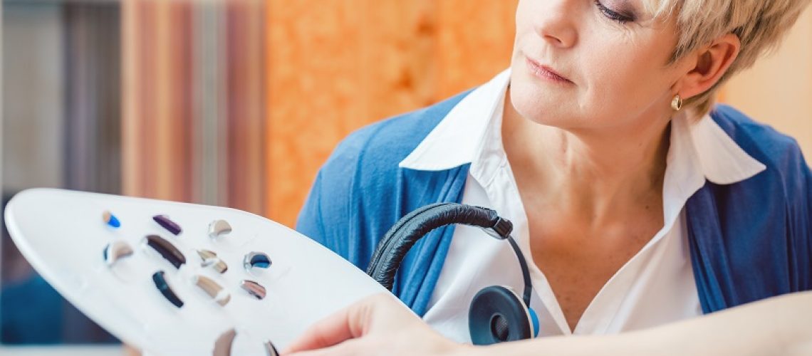 woman choosing new hearing aids