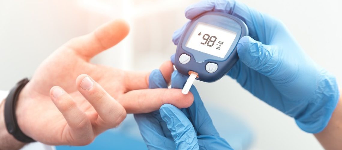 doctor using specialized diabetes tool on patient