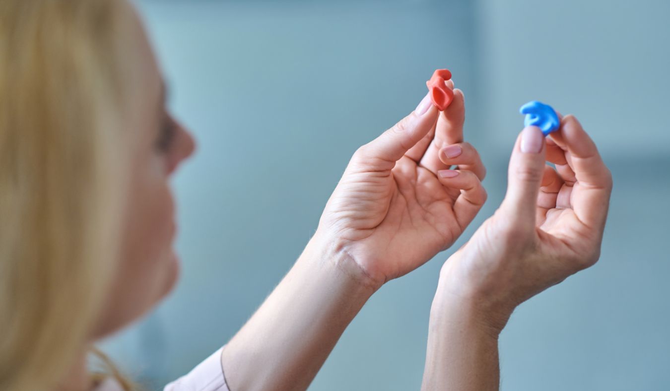 hearing protection ear molds in hand