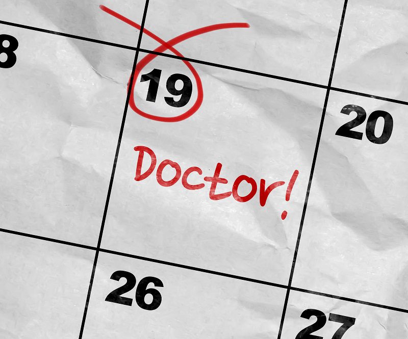 a calendar with doctors note