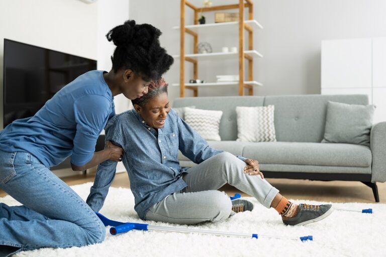 Slip And Fall Risk. Helping African Woman