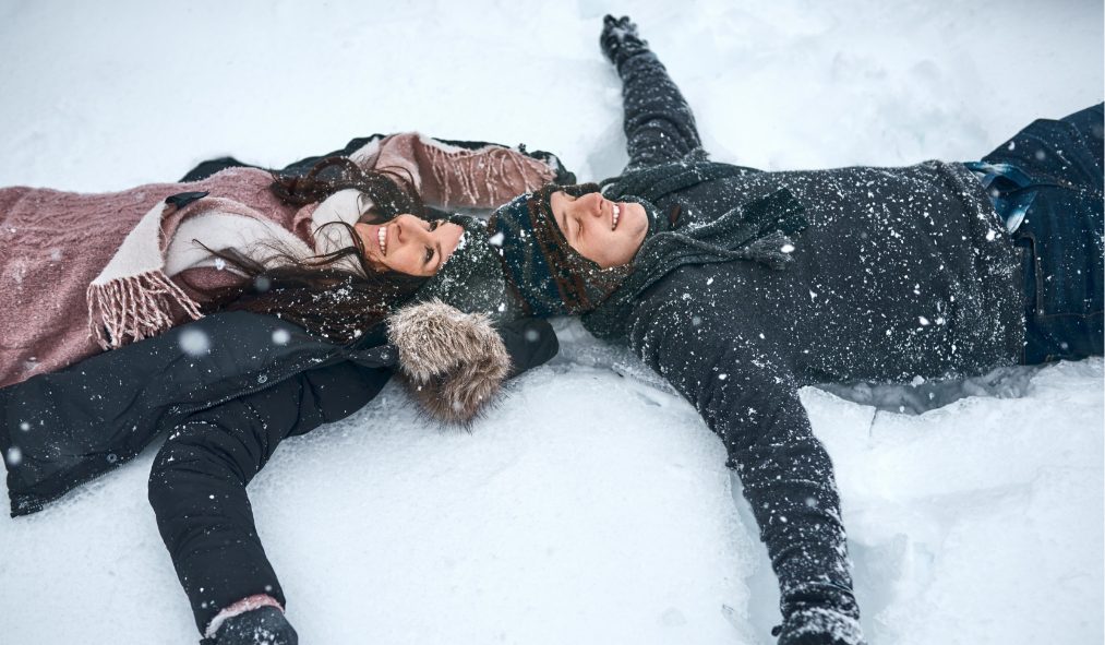 couple making snow angels