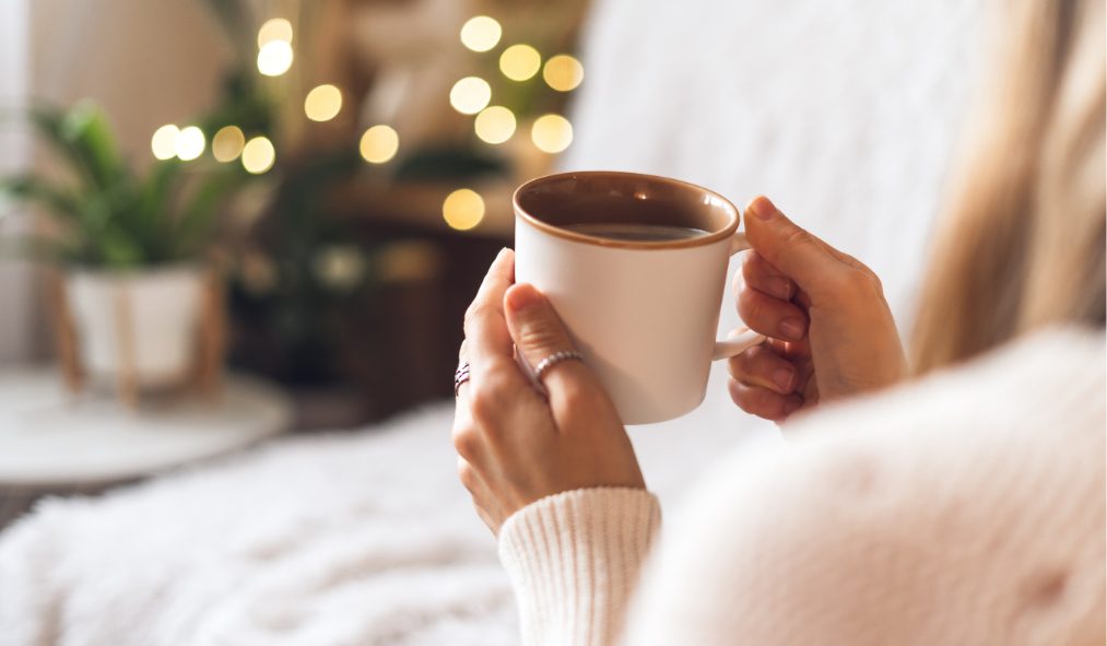hands holding coffee