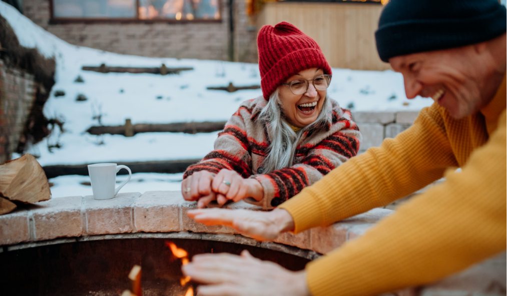 winter senior couple fireplace