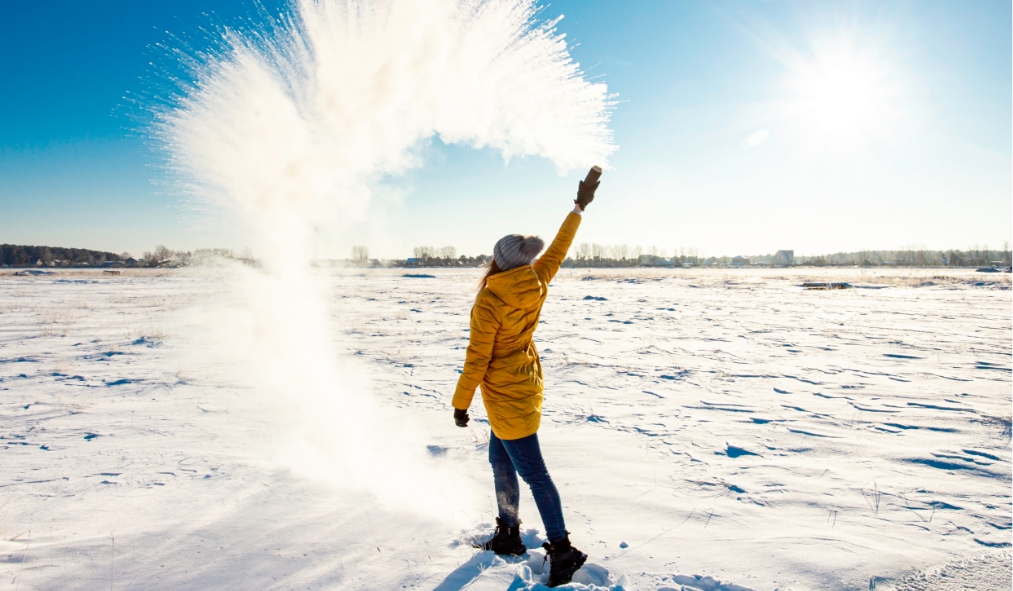 winter woman throwing snow