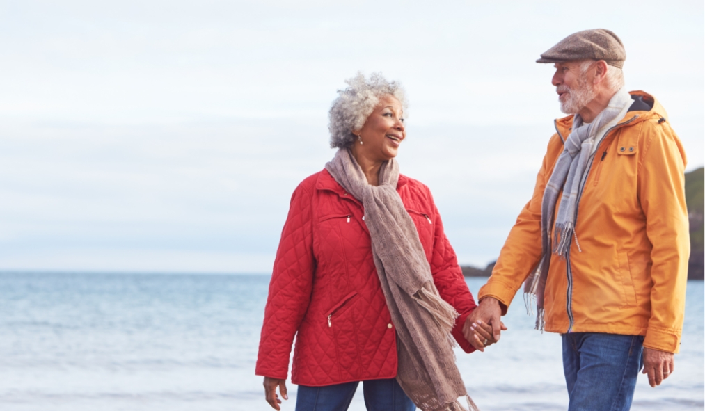 wisconsin senior couple walking by winter shoreline