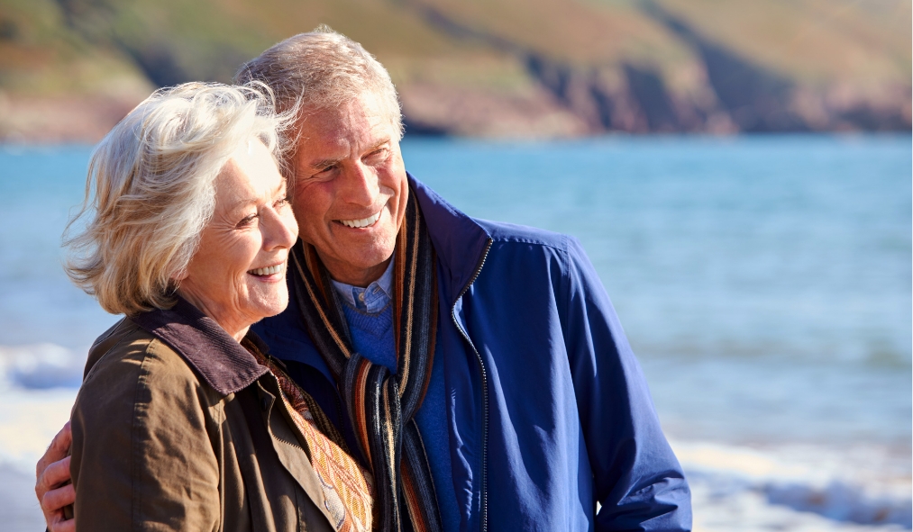 winsconsin senior couple hugging admiring shoreline