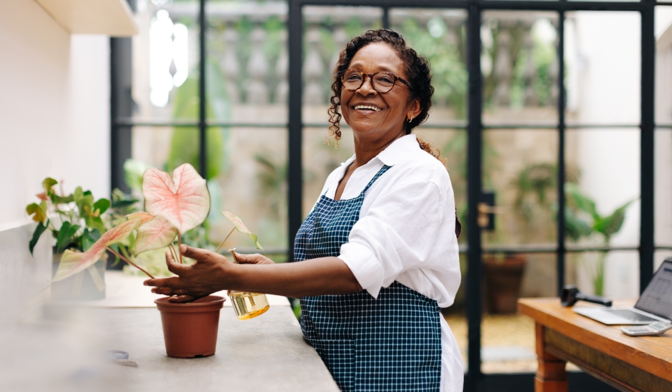 california Flower arranger watering and taking care of a plant