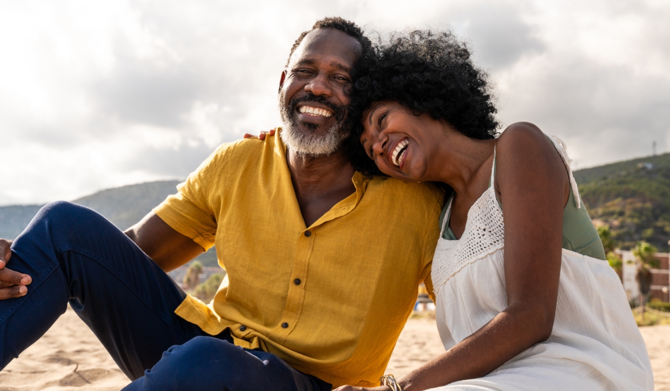 Married african middle aged couple bonding and having fun outdoors