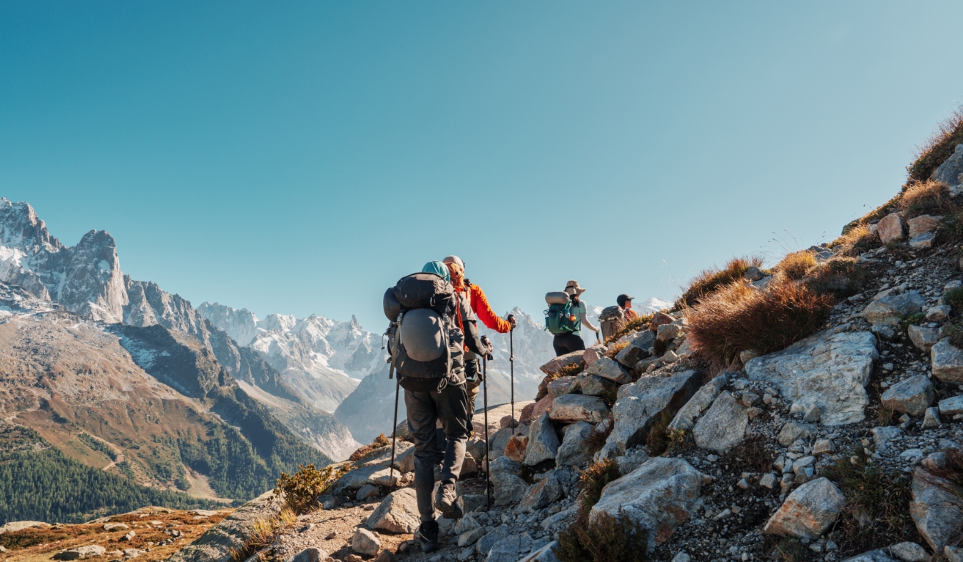 Group of hiker hiking on mountain trail