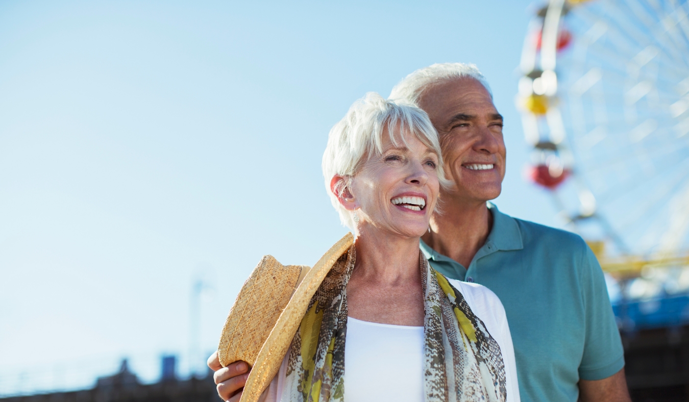 Happy senior couple at amusement park