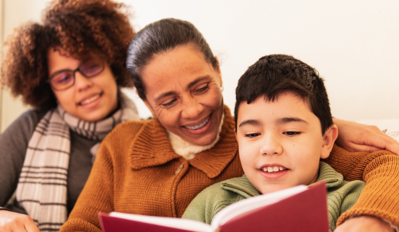 grandmother and grandson reading together